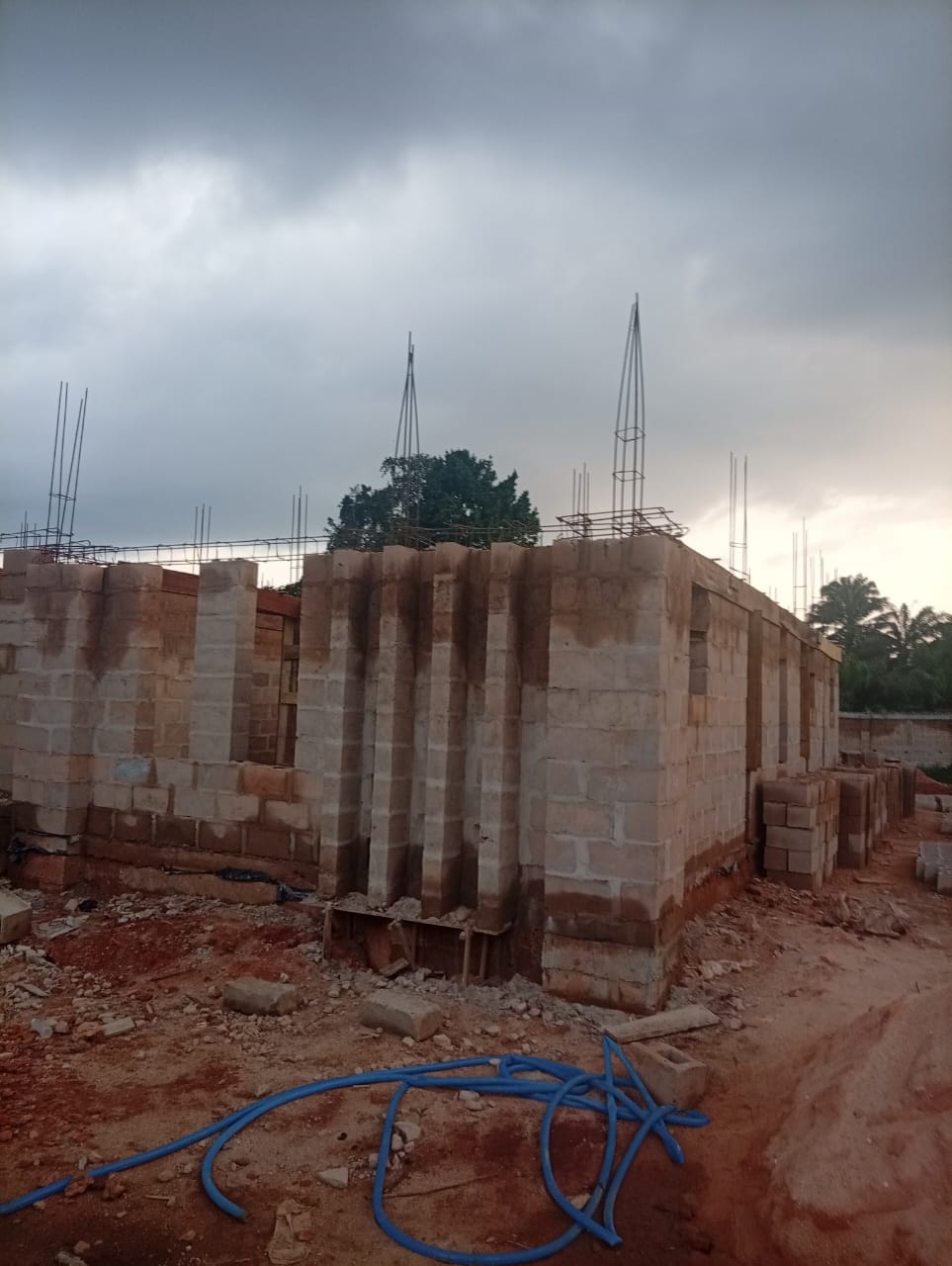 5-bedroom duplex under construction, wider footprint view