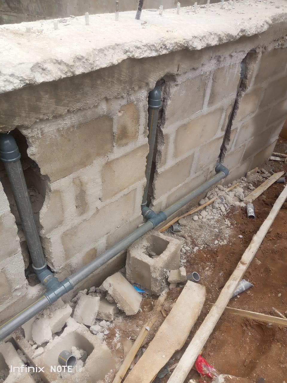 Pool piping connections being installed